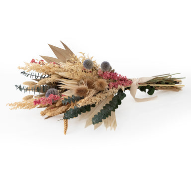 mixed white and pink dried floral bouquet against white background