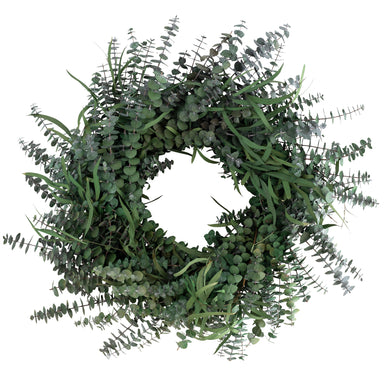 green preserved eucalyptus wreath against white background