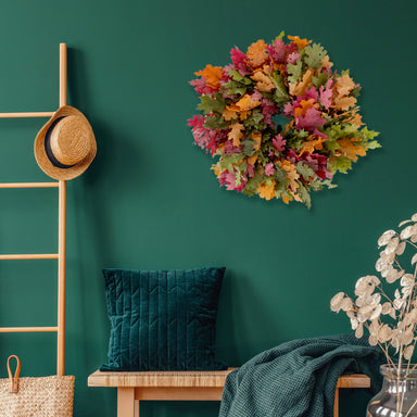 multi color oak leaf wreath against green background