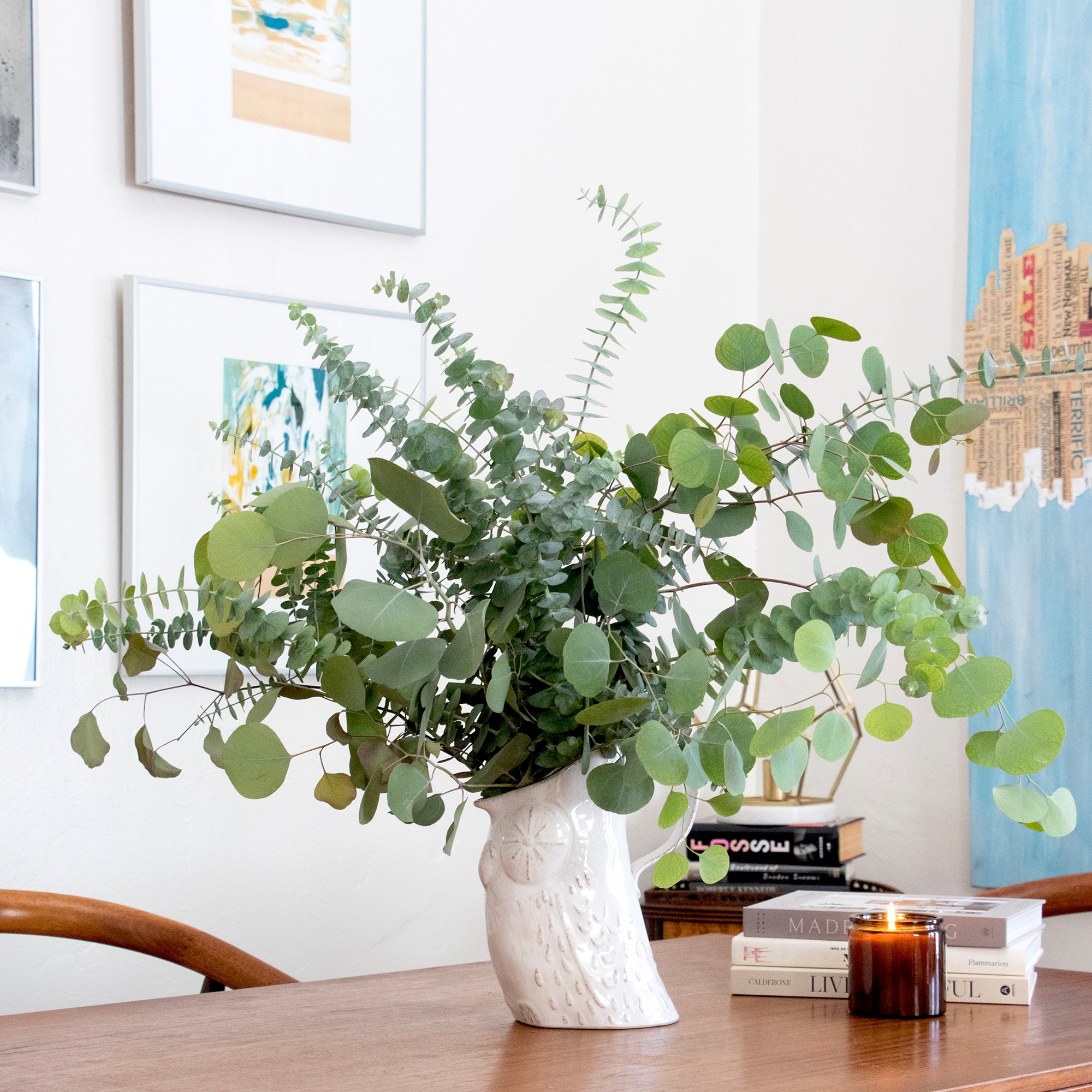 fresh baby and silver dollar eucalyptus bundle against white background in a vase