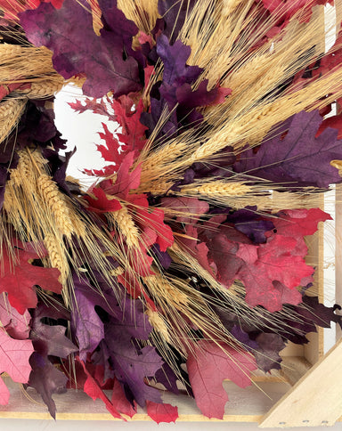 red and purple oak leaf mixed with blonde wheat wreath against white background
