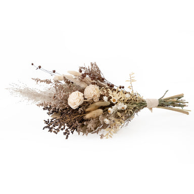 mixed white and tan dried floral bouquet against white background