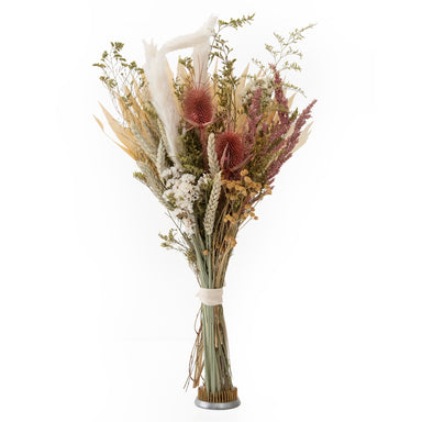 mixed white and pink dried floral bouquet against white background